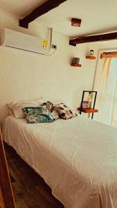 Кровать или кровати в номере Apartamento Pardo1945 TIPO INDUSTRIAL