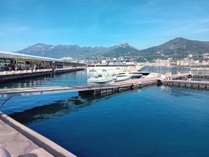 a dock with boats docked in a harbor with mountains at Nuova Luna in Salerno