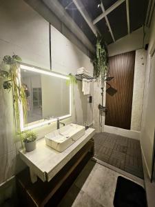 a bathroom with a sink and a bath tub at NYAST VALLEY RESORT, ARPORA in Arpora