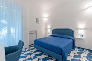 Postel nebo postele na pokoji v ubytování Elite Luxury Suites