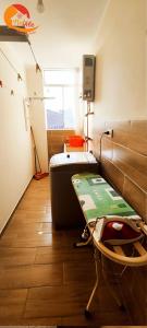 a hospital room with a bed and a table at NatAle Residencial - Departamento Segundo Piso con cochera in Tacna