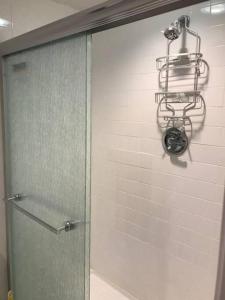 a shower with a glass door in a bathroom at Brooklyn Spring Getaway with Outdoor space in Brooklyn