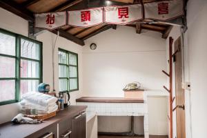 Nhà bếp/bếp nhỏ tại 興華居室港風民宿-鳳山民宿