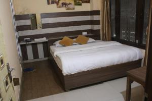 Postel nebo postele na pokoji v ubytování Hotel Opera deluxe + 6 fotografií