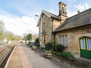 an old train station next to a train track at Ramblers Cottage in Whitby