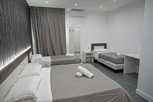 Una cama o camas en una habitación de Hotel Blanc
