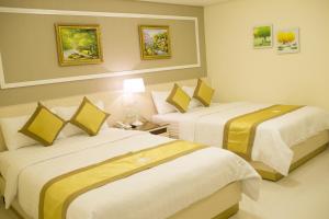 Rúm í herbergi á Hotel Hoang Minh Chau