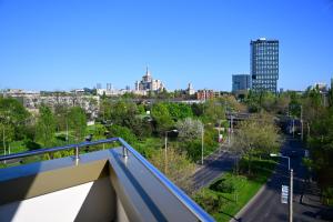 a view of a city from a balcony at Hotel Sir Royal in Bucharest