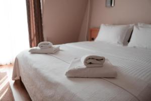 Ένα ή περισσότερα κρεβάτια σε δωμάτιο στο Hotel Topcider