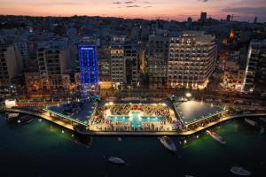 an aerial view of a city at night at Brand New 2 Bed 2 Bath Apartment In Sliema By The Sea in Sliema