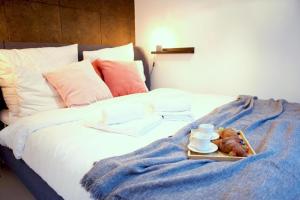 Llit o llits en una habitació de Apartment Kinowa