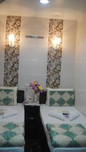 Un pat sau paturi într-o cameră la Philippine Hostel