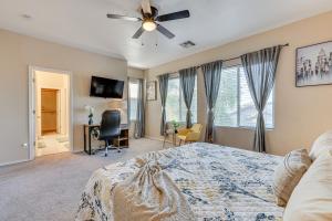 a bedroom with a bed and a ceiling fan at Family-Friendly Phoenix Home 5 Mi to Westgate! in Phoenix