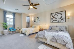 a bedroom with two beds and a ceiling fan at Family-Friendly Phoenix Home 5 Mi to Westgate! in Phoenix