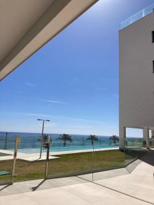 a view of the ocean from a building at Lantia, Loft on the beach in El Campello