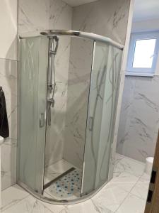 a shower with a glass enclosure in a bathroom at Ubytovanie u Aničky in Nová Sedlica +56 photos