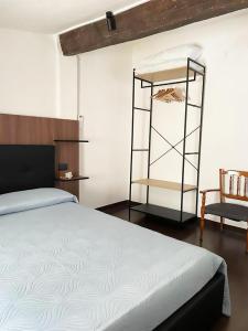 a bedroom with a bed and a book shelf at Il nido del Passero in Gissi