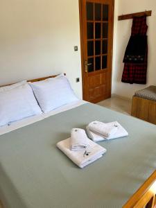 Postel nebo postele na pokoji v ubytování Το σπίτι της πλατείας