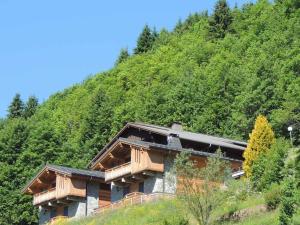 a house on the side of a mountain at Chalet Les Gets, 5 pièces, 6 personnes - FR-1-598-24 in Les Gets