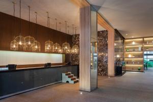 a lobby with chandeliers hanging from the ceiling at Paradisus Playa del Carmen - Riviera Maya - All Inclusive in Playa del Carmen +186 photos