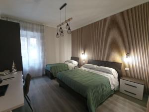 Postel nebo postele na pokoji v ubytování BariVera rooms