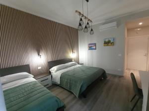 Postel nebo postele na pokoji v ubytování BariVera rooms + 13 fotografií