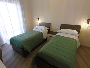 Postel nebo postele na pokoji v ubytování BariVera rooms