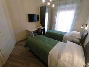 Postel nebo postele na pokoji v ubytování BariVera rooms
