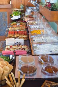 a buffet line with many different types of food at west coast boutique hotel in Bodrum City