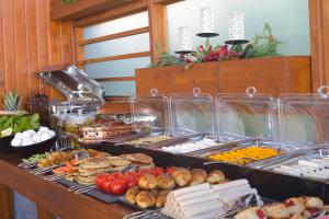 a buffet with many different types of food on a table at west coast boutique hotel in Bodrum City