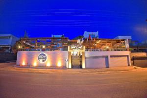a building on the side of a street at night at west coast boutique hotel in Bodrum City