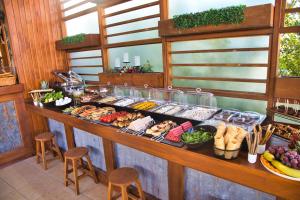 a buffet line with many different types of food at west coast boutique hotel in Bodrum City