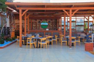 a group of tables and chairs in a restaurant at west coast boutique hotel in Bodrum City