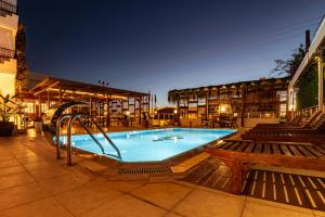 a swimming pool with a slide in a building at west coast boutique hotel in Bodrum City