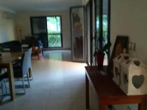 a living room with a table and a dining room at Casa en Panorámica Golf, Sant Jordi in Sant Jordi