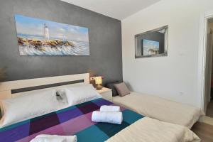 Кровать или кровати в номере Nettes Appartement in Gradac mit Terrasse