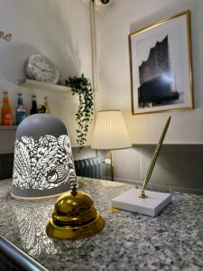 a table with a lamp and a knife on a counter at Hotel Kieler Hof am Hauptbahnhof - Hamburg Central Station in Hamburg