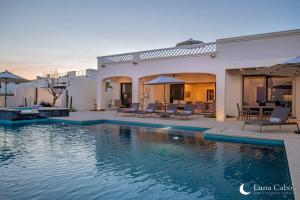 a house with a swimming pool in front of it at Luxe Oceanview Villa with Pool Hot Tub BBQ and Fire Pit in San José del Cabo
