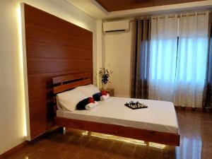 Ліжко або ліжка в номері GBU Loboc River Guesthouse