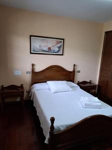 Postel nebo postele na pokoji v ubytování Hostal - Restaurante Casa Cuña + 17 fotografií