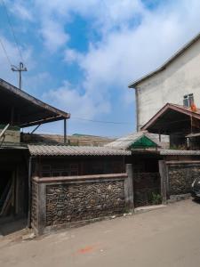 an old building in a village with a church at Homestay Darjeeling in Darjeeling