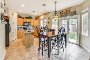 a kitchen with a wooden table and chairs at Private Yard Las Vegas Sanctuary on Cul-De-Sac in Las Vegas