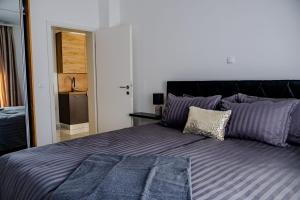 Postel nebo postele na pokoji v ubytování Stylish House Aurora