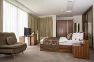 TV a/nebo společenská místnost v ubytování Hotel Royal Gold City