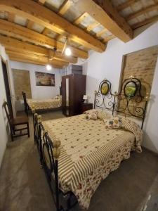 Ένα ή περισσότερα κρεβάτια σε δωμάτιο στο Casa Borgo Fonte