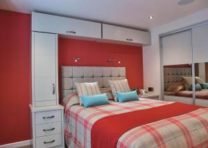 A bed or beds in a room at Calvert Trust Kielder 