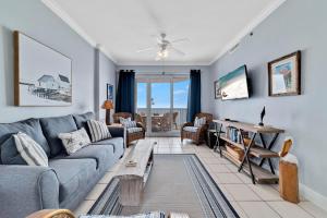 a living room with a couch and a table at Island Royale 701 in Gulf Shores