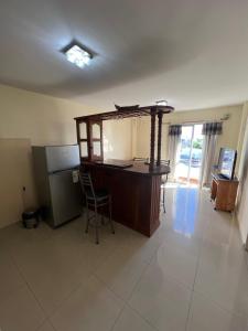 a kitchen with a desk and a chair in a room at Relax Haedo norte in Villa Sarmiento