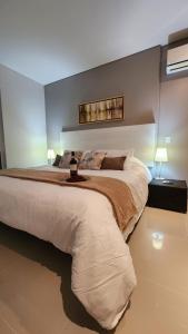 Katil atau katil-katil dalam bilik di APARTAMENTO DE LUJO PARA PAREJAS