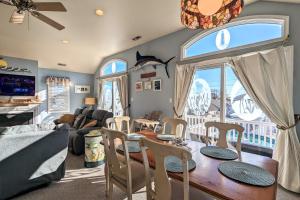 a living room with a table and chairs and a dining room at Waves n Wooder by AvantStay SwimSpa Game Room Walk to Beach in Wildwood